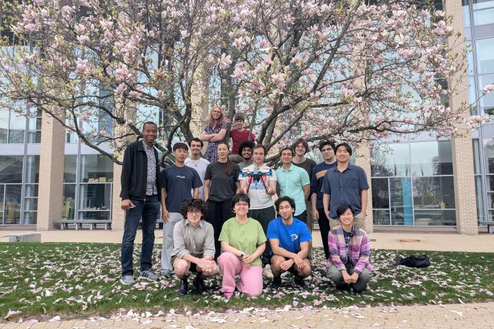 Members of the Olin College Automated Farming Drone research team are shown on the Oval in front of the Miller Academic Center.