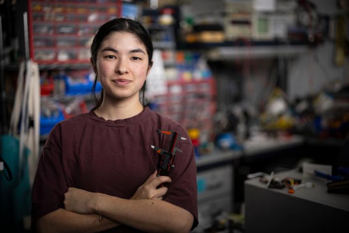 student with arms crossed