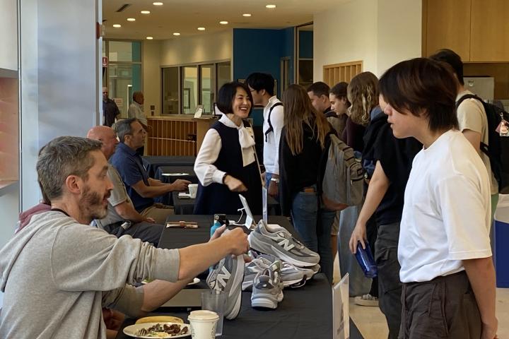 Students speak with SCOPE Liaisons at the Sponsor Showcase.