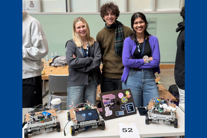 Team Triad, including two Olin College students, pose with their MakeMIT x Harvard hackathon project. 