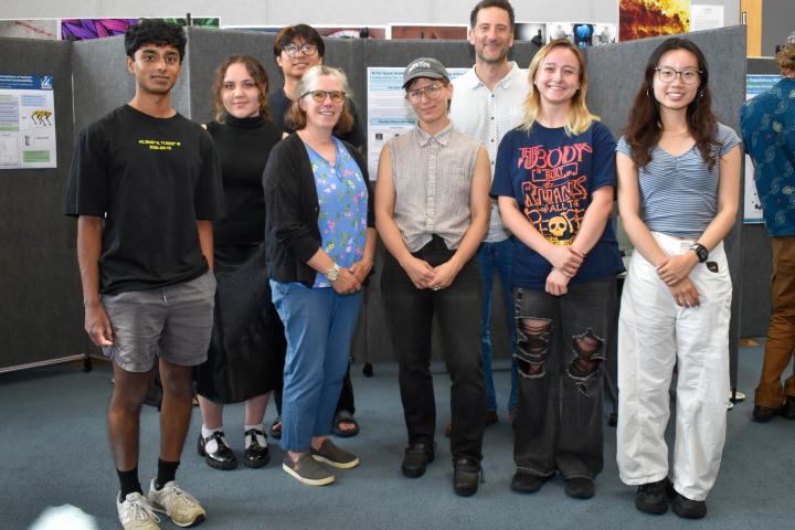 Olin Professors Paul Ruvolo and Caitrin Lynch pose for a group photo with Olin students.