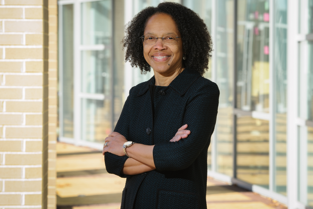 Gilda A. Barabino, Ph.D. A photo of a woman smiling with her arms crossed over her chest standing outside