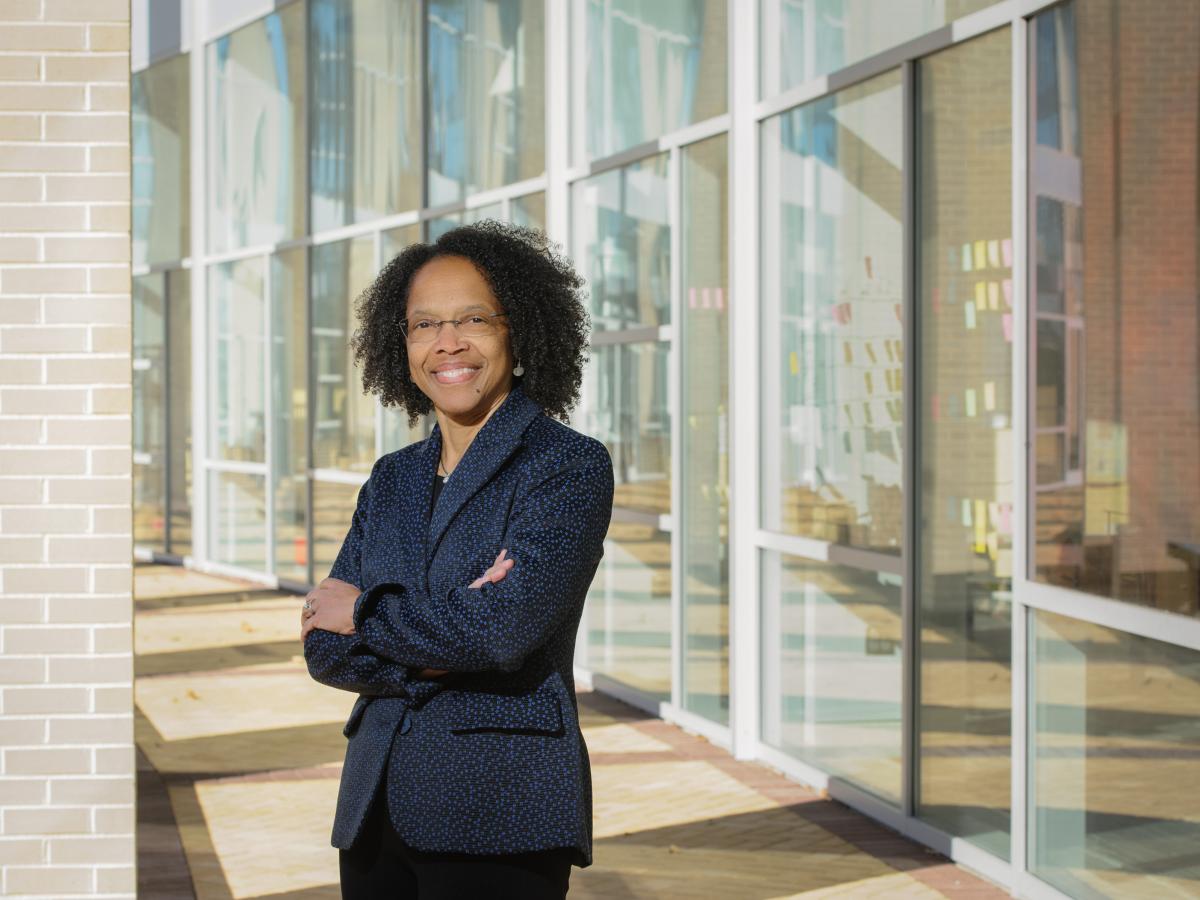 Olin College President Gilda Barabino poses with a smile outside Olin's Academic Center in 2020.