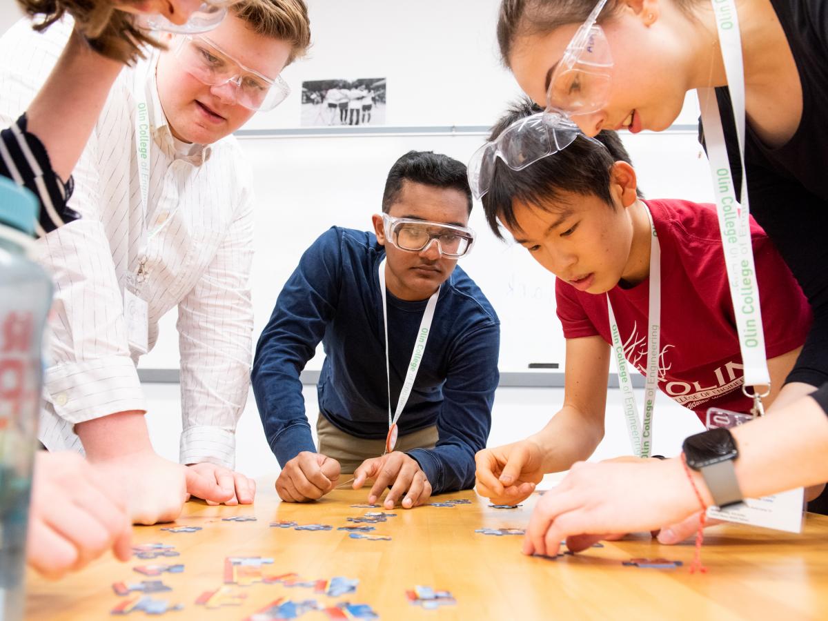 Olin College of Engineering students work together on a puzzle project