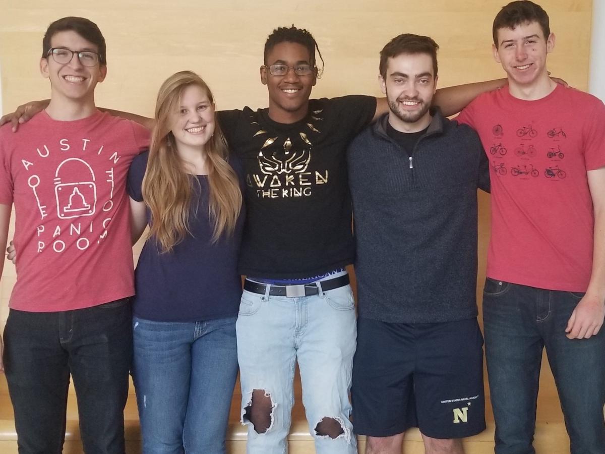 Olin students pictured (L to R) Corey, Libby, Shyheim, Bryce, Daniel. Five college students stand shoulder-to-shoulder for a photo.
