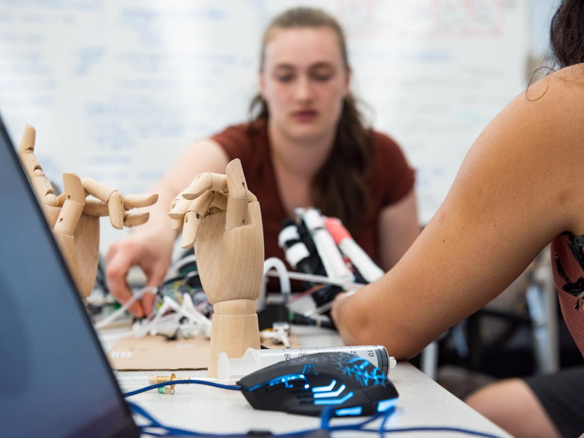 Olin College student researchers work on developing a glove with soft robotic actuators Olin College student researchers work on developing a glove with soft robotic actuators