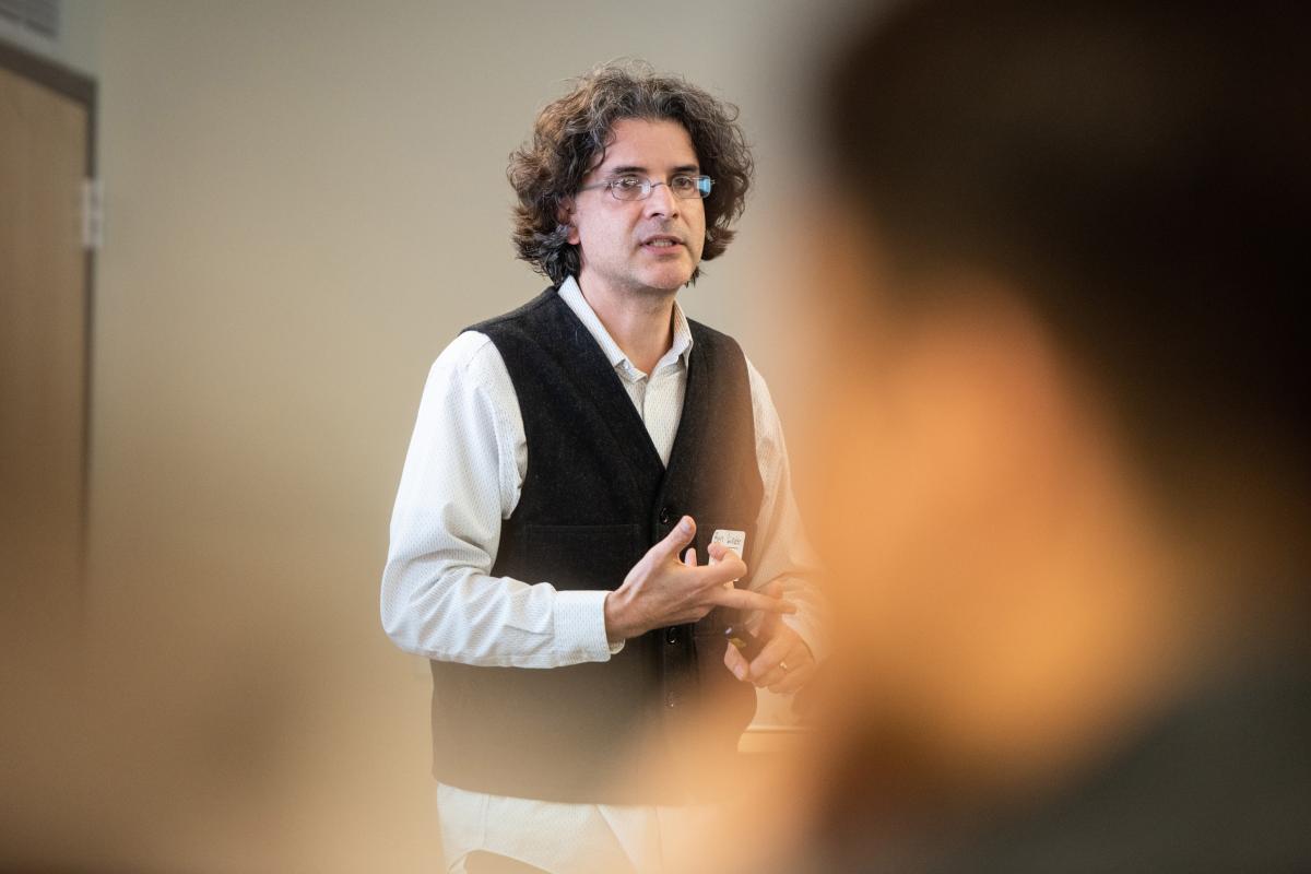 A photo of Ben Linder standing in front of a classroom