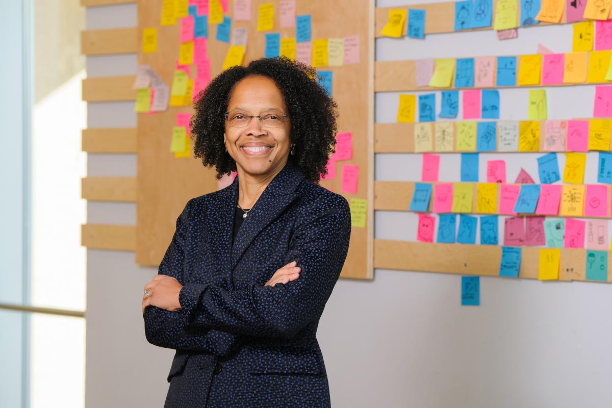 Olin College of Engineering President Gilda A. Barabino President Gilda A. Barabino stands in front of a wall with colorful sticky notes on it.