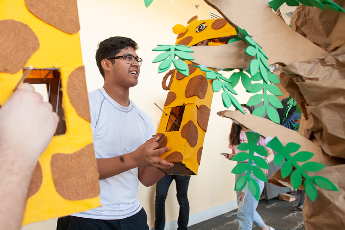 Olin First Year's hold their Design Nature hoppers for a group photo in October 2021 in