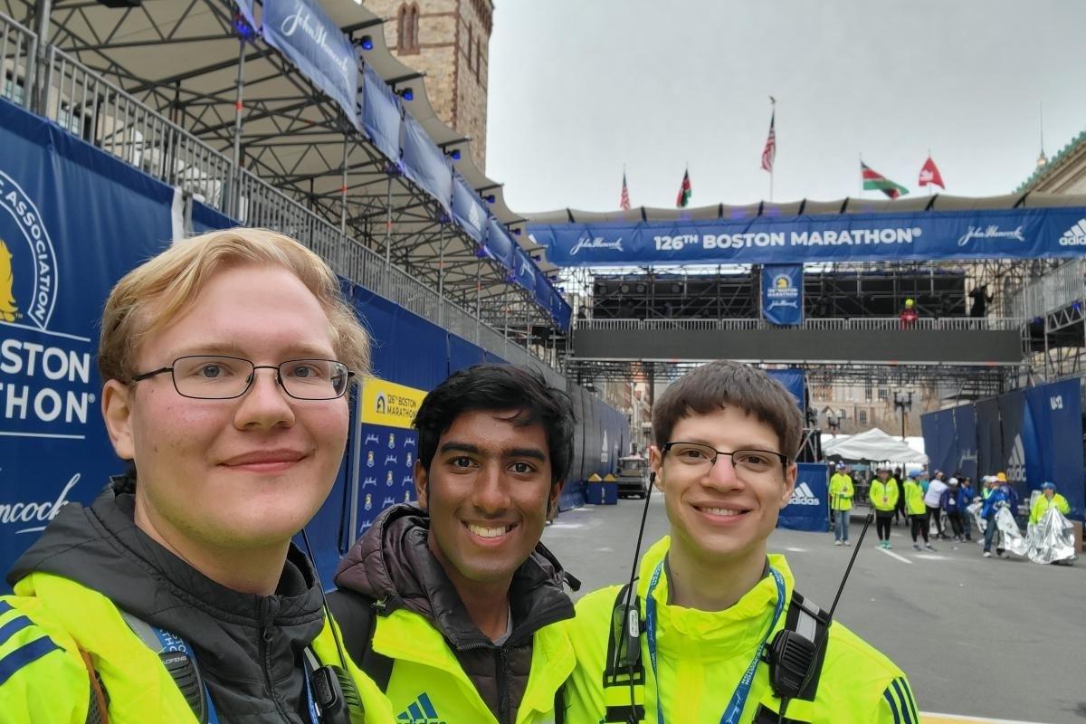 Zachary '23, Sparsh '22 and Phillip '25 take a selfie at the 2022 Boston Marathon finish line.