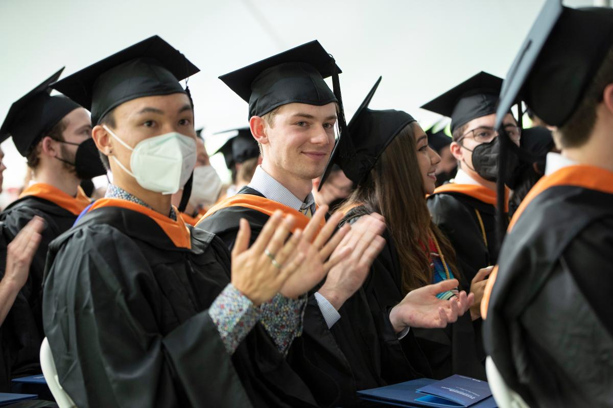 Members of the Class of 2022 clap during the Olin Commencement ceremony on May 15, 2022. Members of the Class of 2022 clap during the Olin Commencement ceremony on May 15, 2022.
