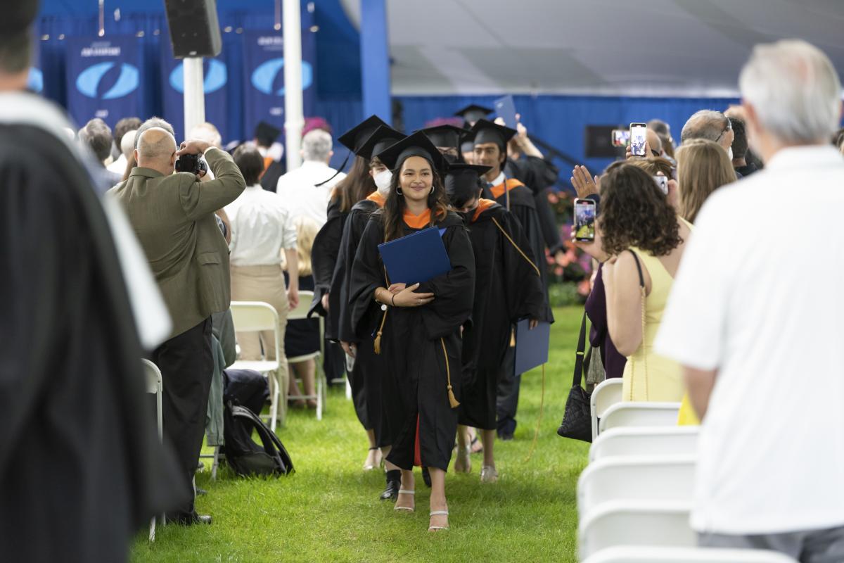 Members of the Class of 2022 process out of the tent at the close of the Commencement ceremony.