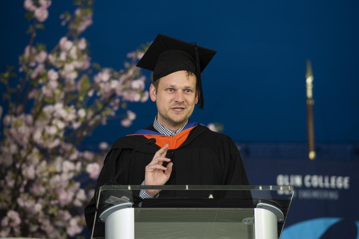 Lee Edwards '07, an alum and member of the Olin College Board of Trustees, speaks during Inauguration on May 5, 2022. 