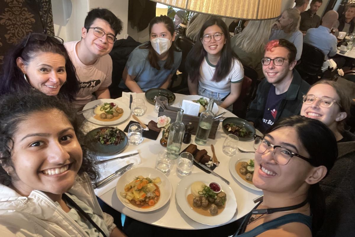 FIE team photo around dining table