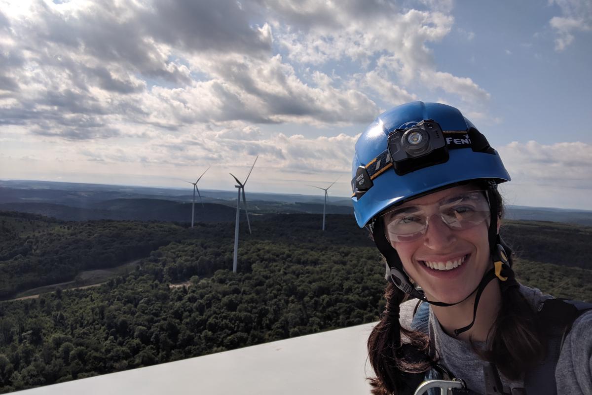Meg Lidrbauch '17 on top of the tallest turbines in the country (as of 2019).