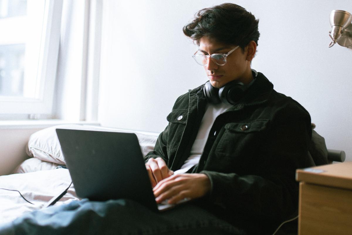 Walter Villa '23 works on laptop. Walter Villa '23 works on laptop.