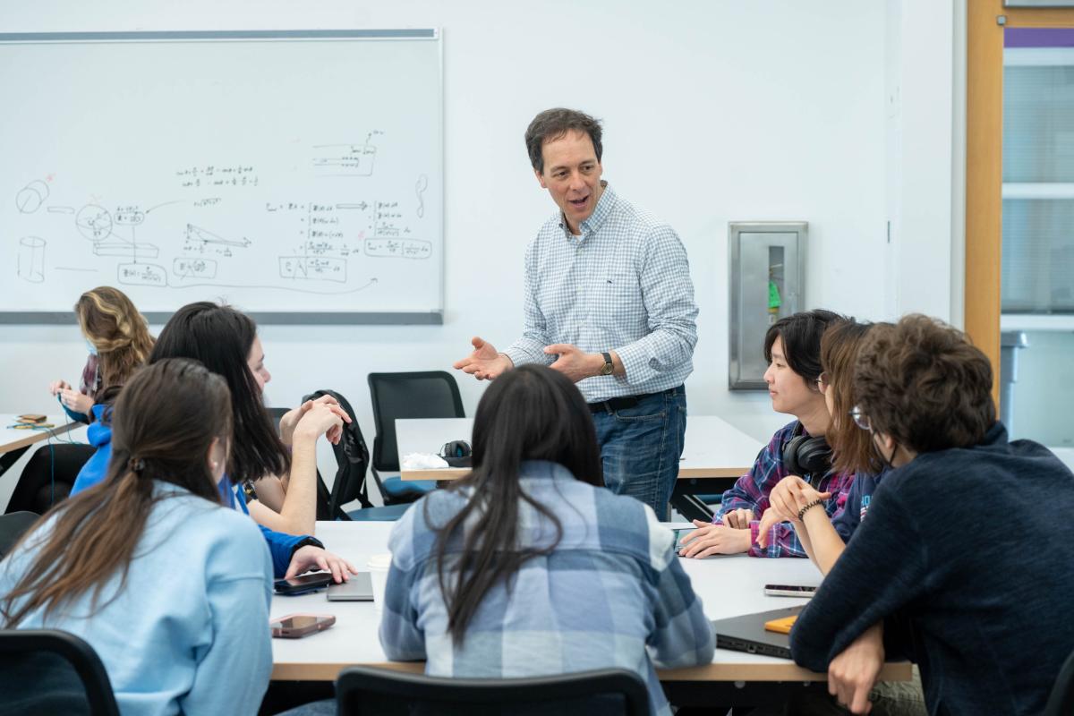 Rob Martello discussing with students in Engineering for Context Classroom