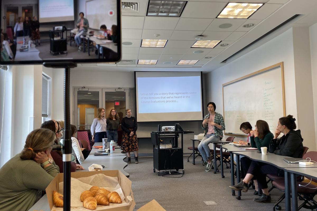 A team of students present to an audience. A team of students present to an audience.
