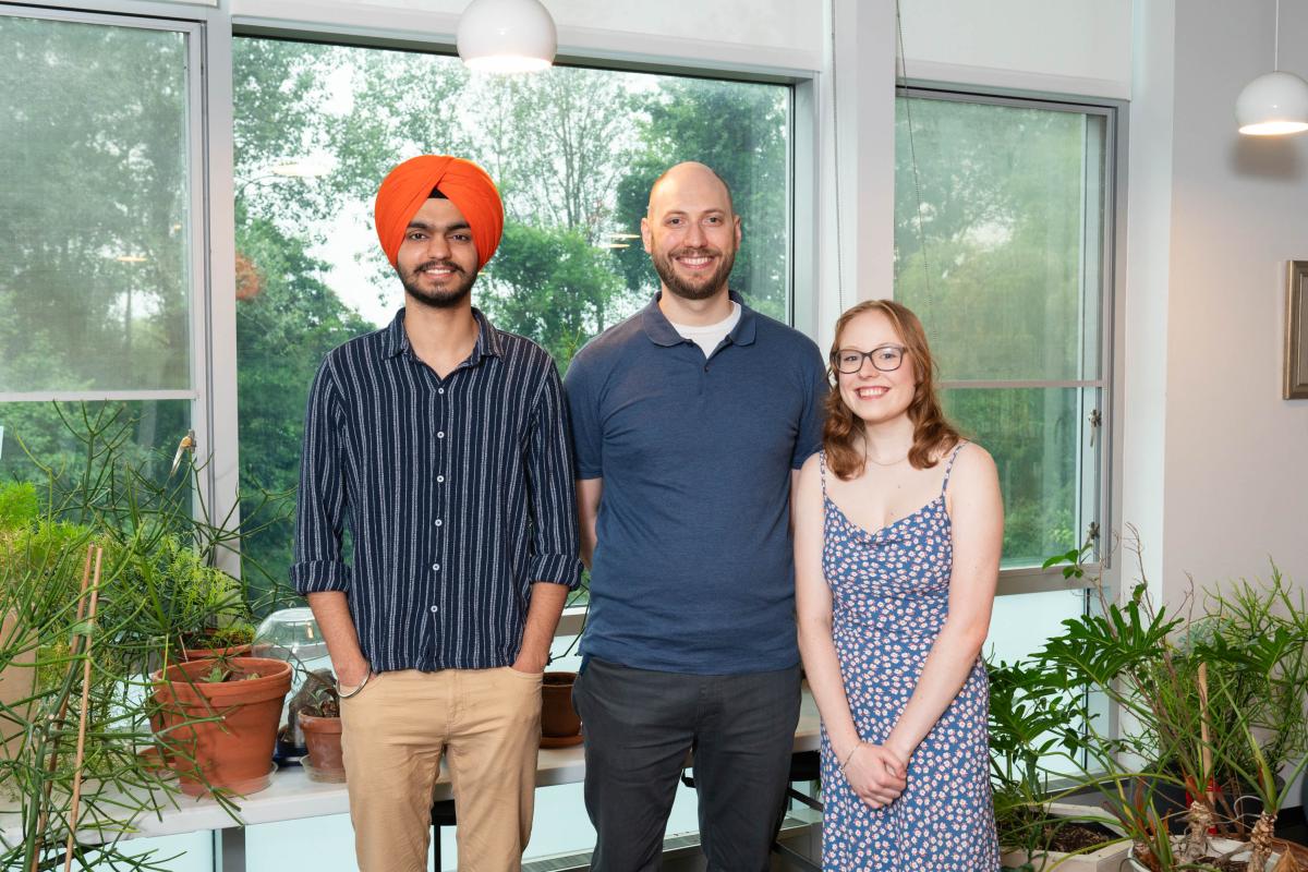 Summer team picture - Anmol, Erhardt, and Bethany standing together and smiling at camera Summer team picture - Anmol, Erhardt, and Bethany standing together and smiling at camera