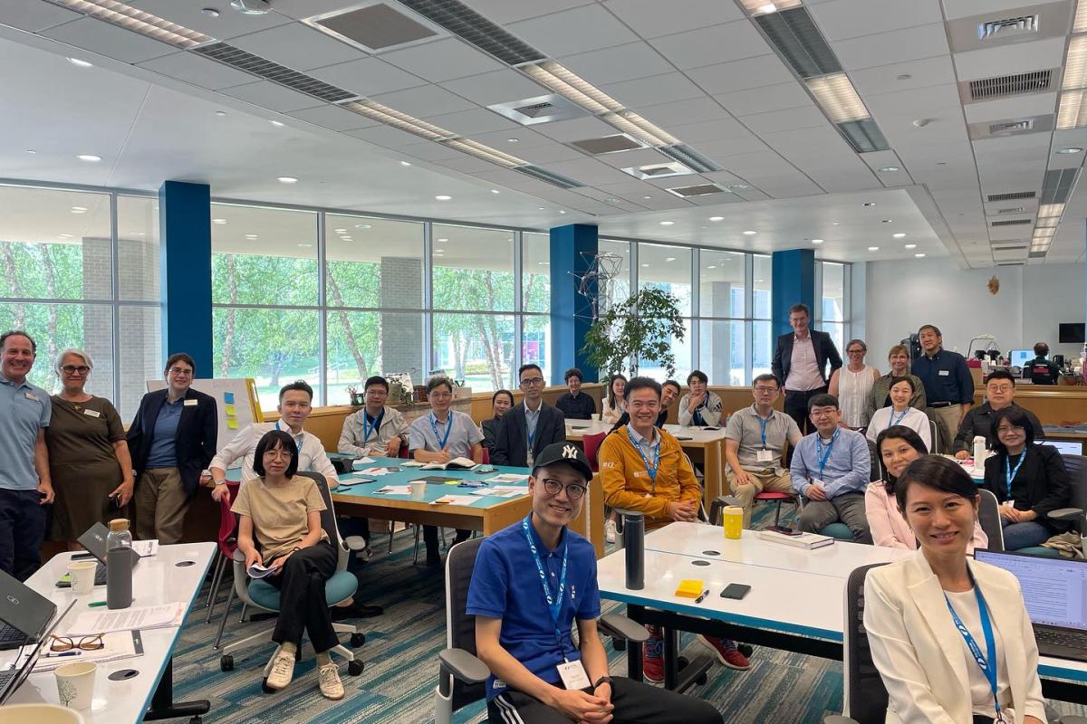 Summer Studio Group of visitors from Chian with Olin faculty and staff in the library