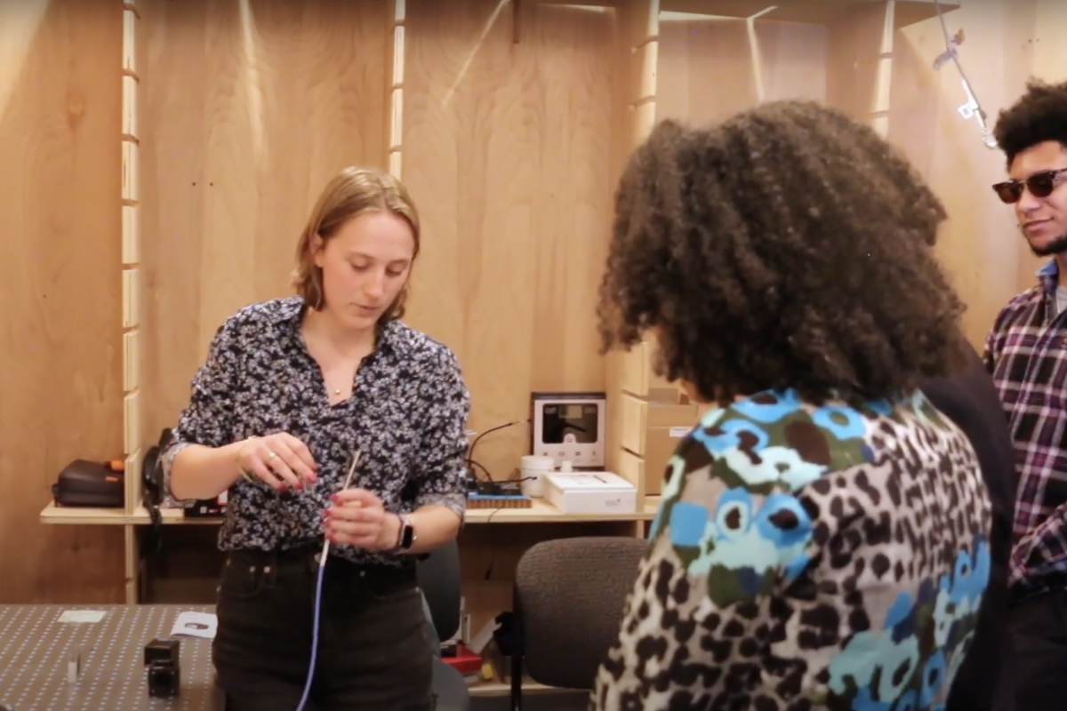 Members of the HEAL lab demonstrate research during a visit from Olin President Gilda Barabino and Olin founder Larry Milas in Summer 2023.