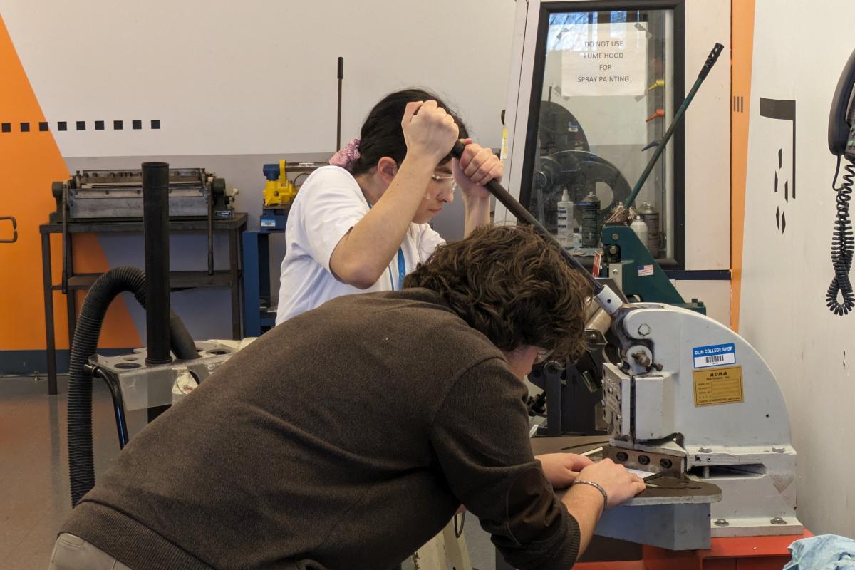 Two Olin students working in the metals shop. Two Olin students working in the metals shop.