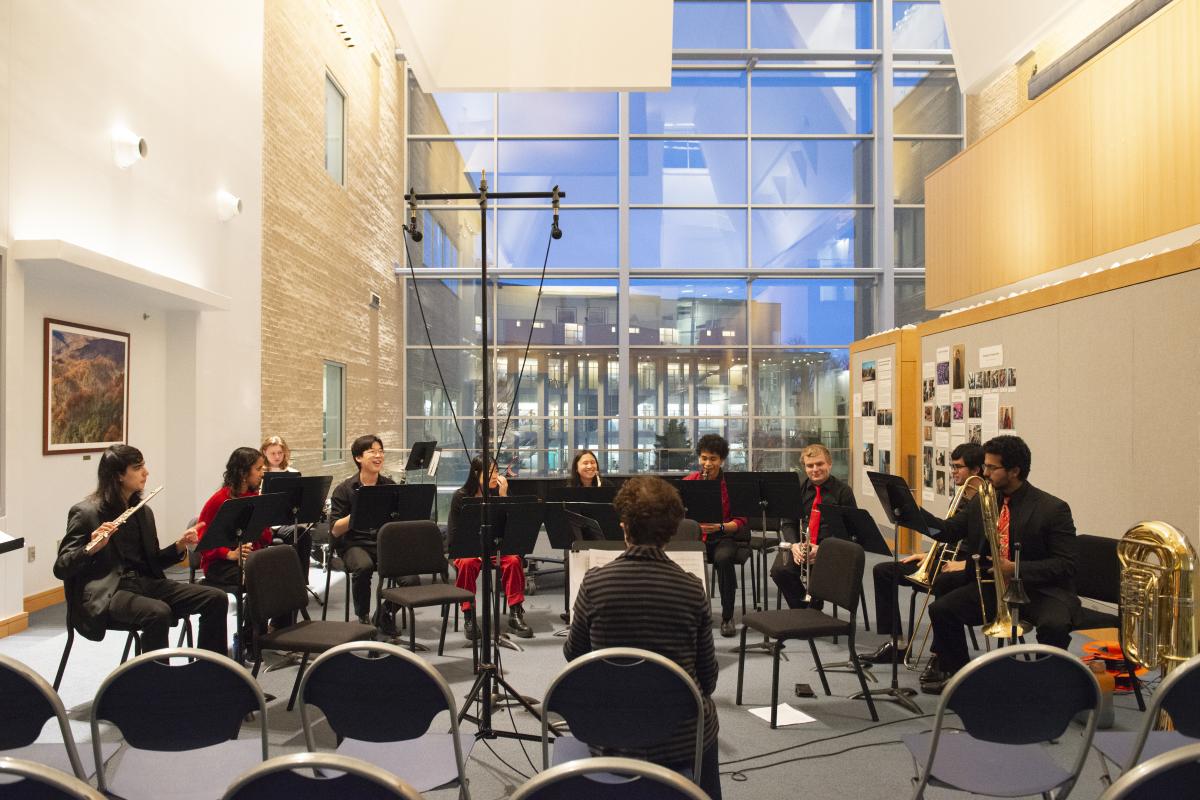 Professor Diana Dabby sits with members of the Olin Conductorless Orchestra (OCO) before a performance in December 2022. Professor Diana Dabby sits with members of the Olin Conductorless Orchestra (OCO) before a performance in December 2022.