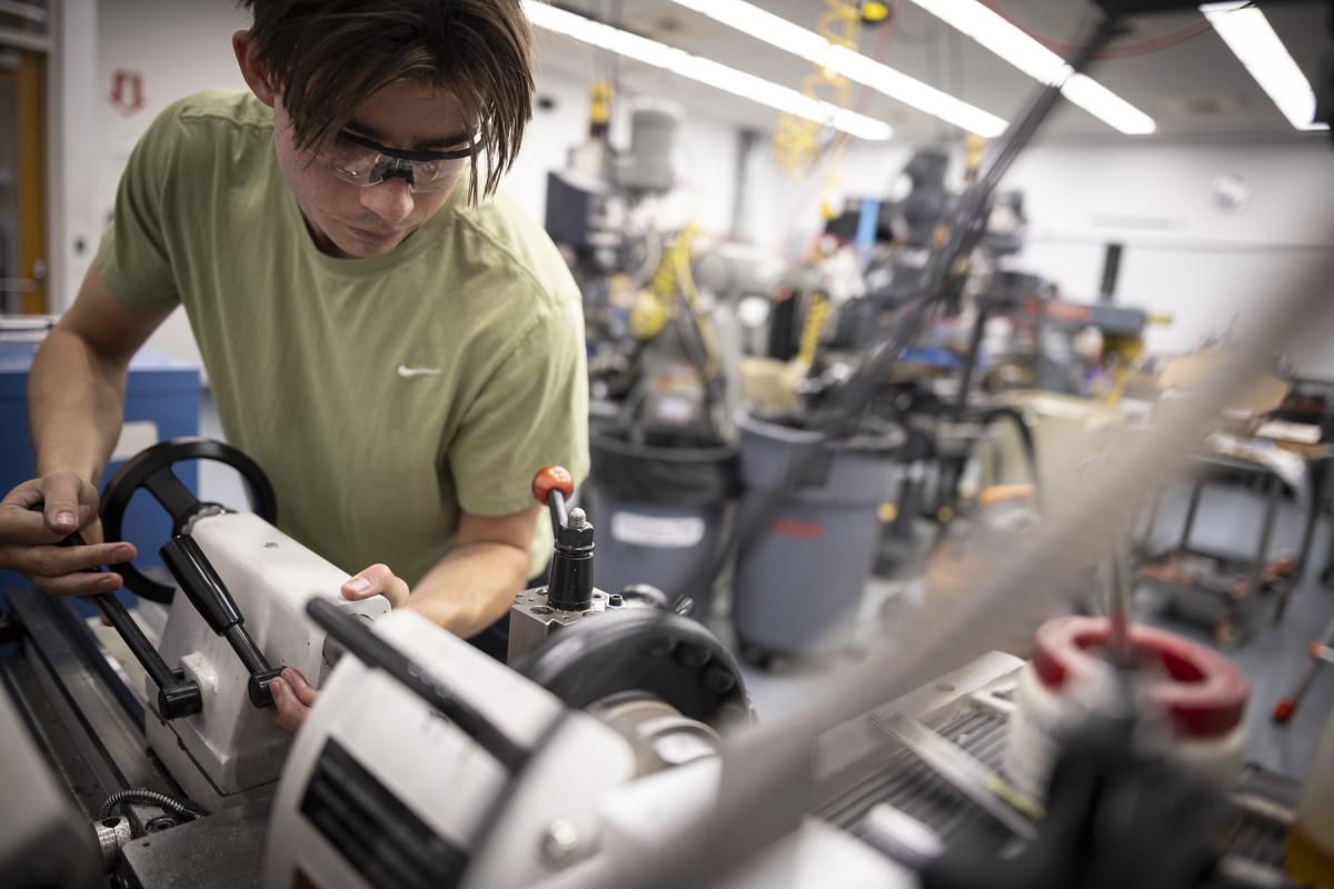 An Olin College of Engineering student works in the machine shop. An Olin College of Engineering student works in the machine shop.