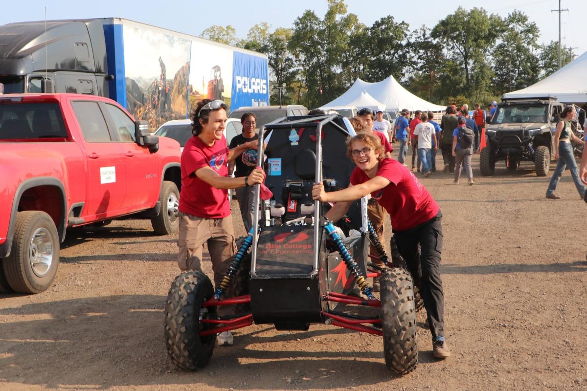 Members of the Olin Baja team push their off-road vehicle forward during the SAE Competition in September 2024. Members of the Olin Baja team push their off-road vehicle forward during the SAE Competition in September 2024.