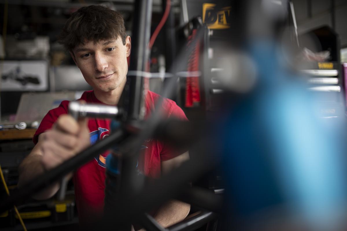 An Olin student and member of Baja works on a vehicle in the garage. An Olin student and member of Baja works on a vehicle in the garage.
