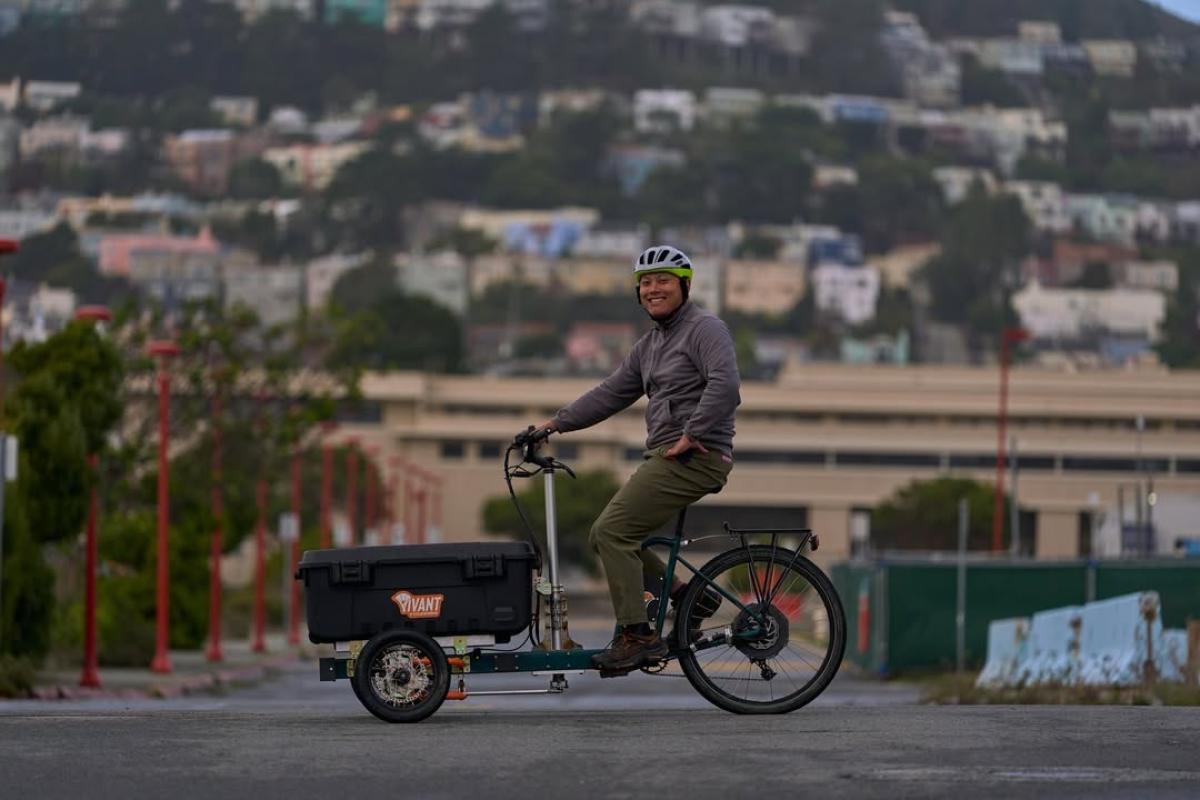 James Nee '15 is shown riding Vivant Cycleworks' cargo e-bike, Juno. 