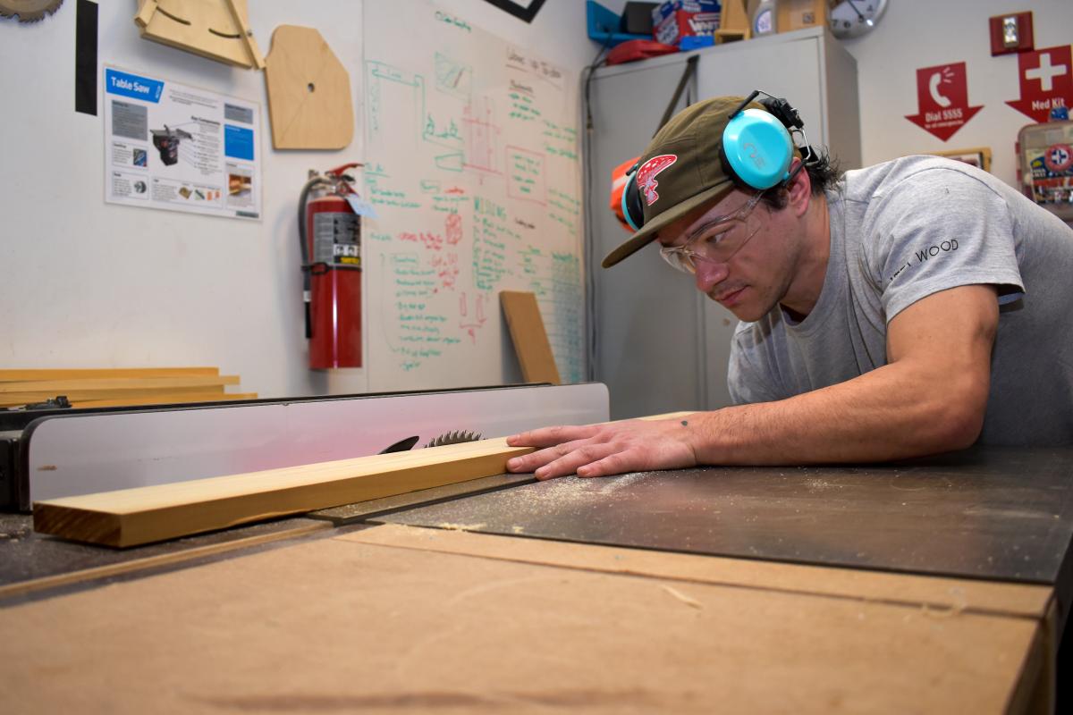 Dyllan Nguyen is shown working in the Olin Wood Shop. Dyllan Nguyen is shown working in the Olin Wood Shop.