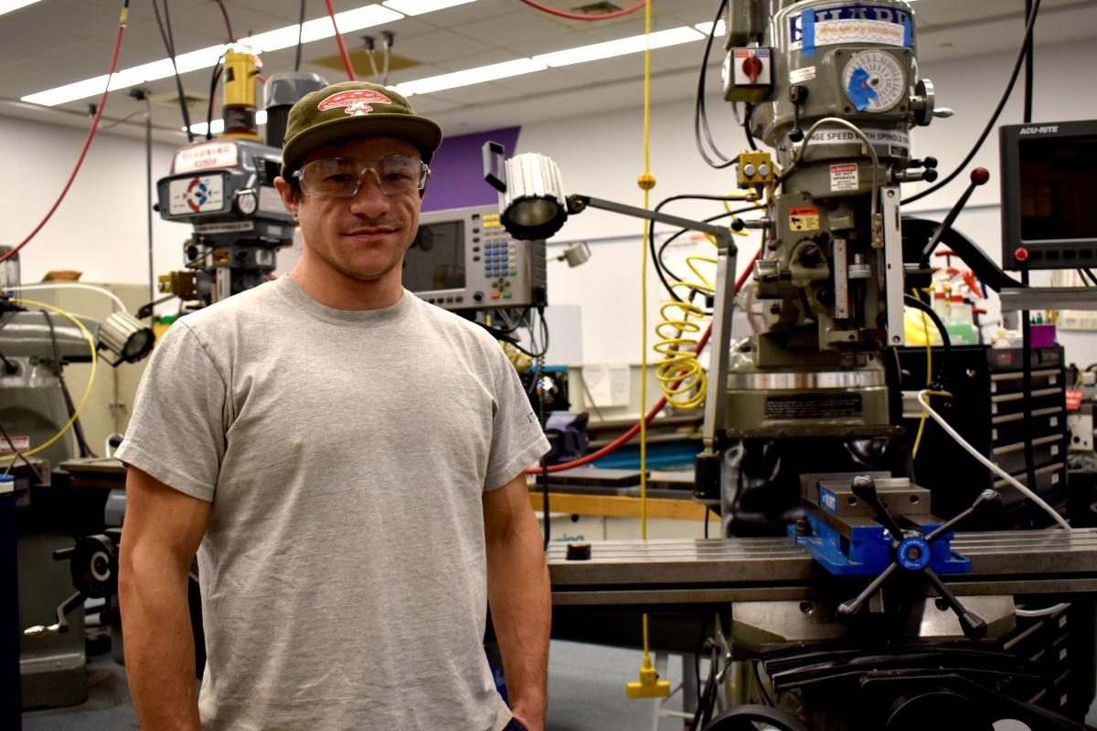 Dyllan Nguyen is shown standing in the Olin Shop. Dyllan Nguyen is shown standing in the Olin Shop.