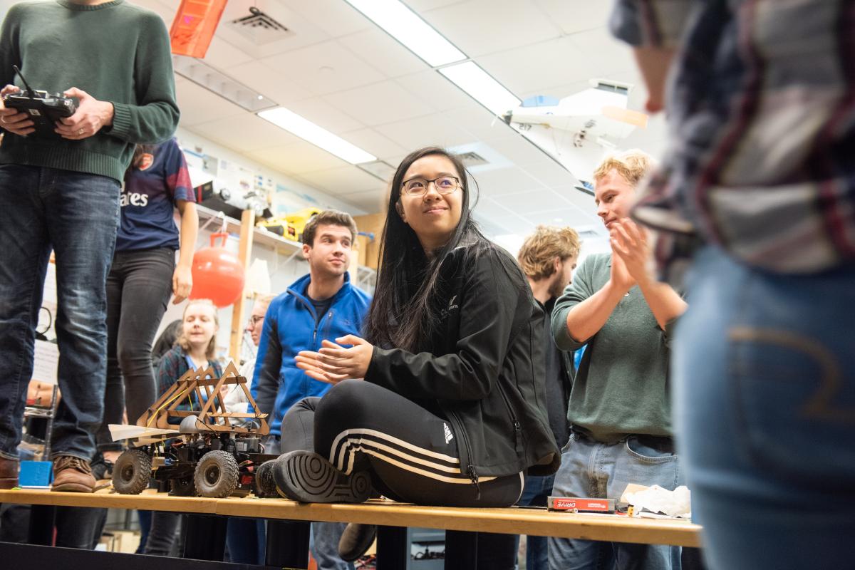 An Olin student sits on a table in the RoboLab at Olin College. An Olin student sits on a table in the RoboLab at Olin College.
