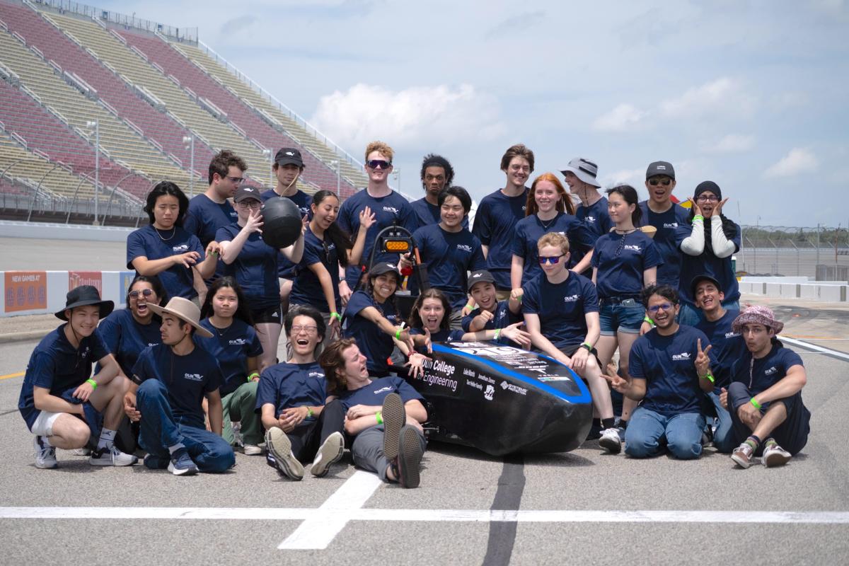 The Olin Electric Motorsports team pose with their car at the Formula SAE Electric competition in 2024. The Olin Electric Motorsports team pose with their car at the Formula SAE Electric competition in 2024.