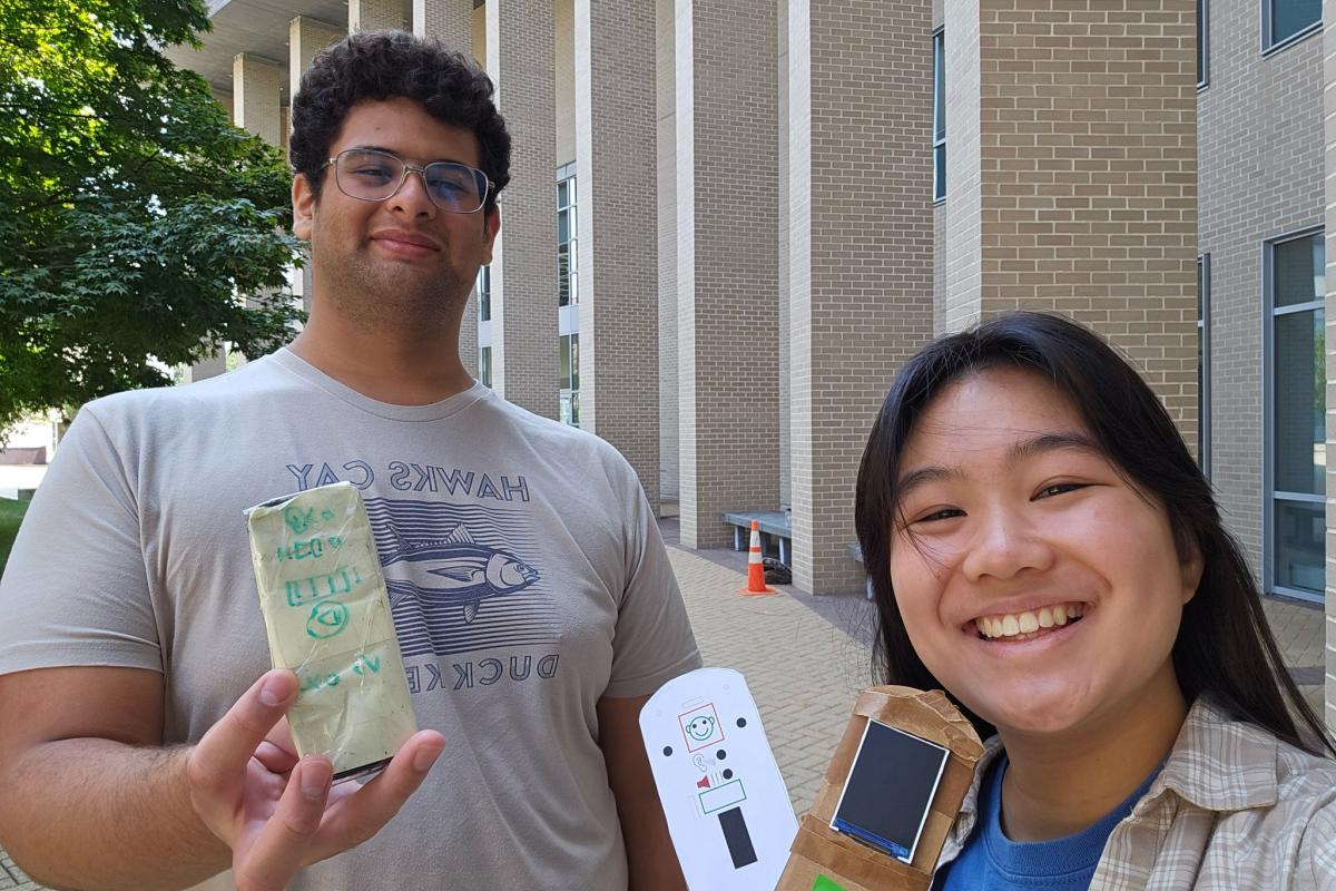 Albert Manrique '25 Arianne Fong '27 are pictured at Olin College holding up two reprogrammable hearing testing device user interface prototypes. Albert Manrique '25 Arianne Fong '27 are pictured at Olin College holding up two reprogrammable hearing testing device user interface prototypes.
