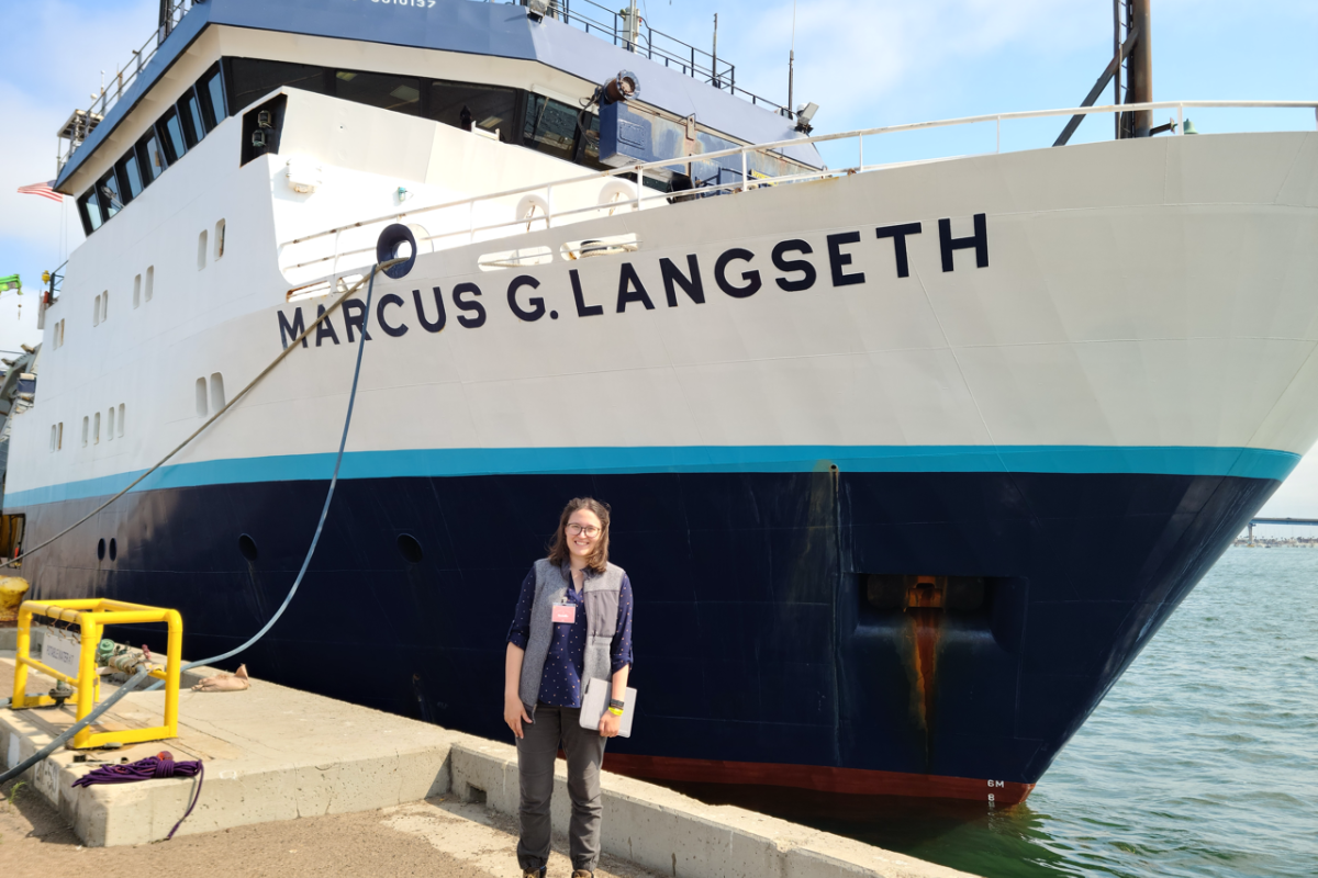 Victoria Preston ’16 stands in front of the Marcus G. Langseth ship.