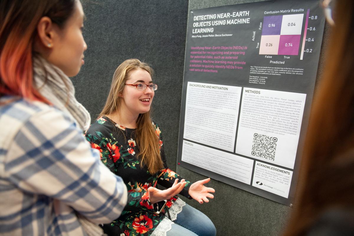 An Olin student presents their Astro Stats poster research.