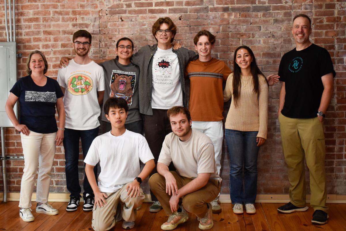 ACRONYM students with Wavelength co-owners Jim and Deanna Varney. A group of students stand with the owners of Wavelength, a local coffee roaster in Shirley, MA.