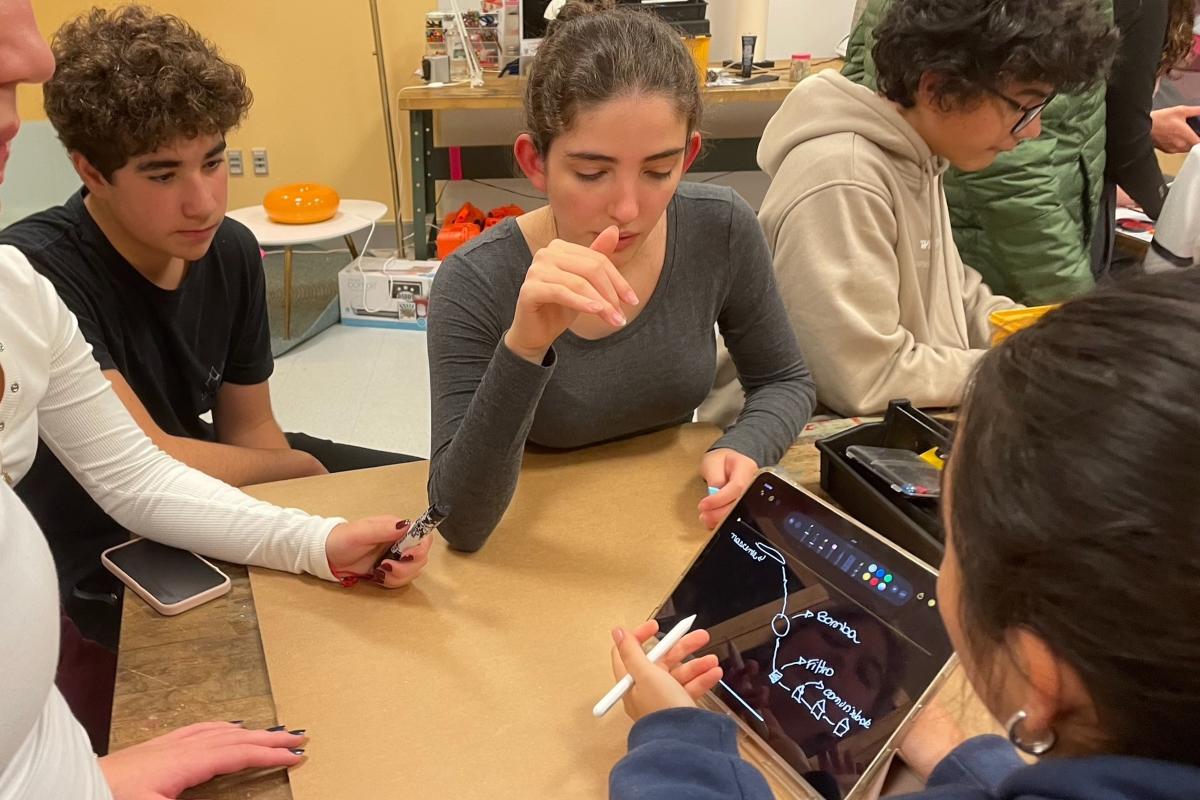 High school students from the IDIN program are seen working on a project at Olin College.