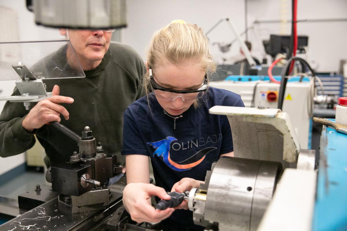 An Olin Baja student team member uses a machine in the Shop.