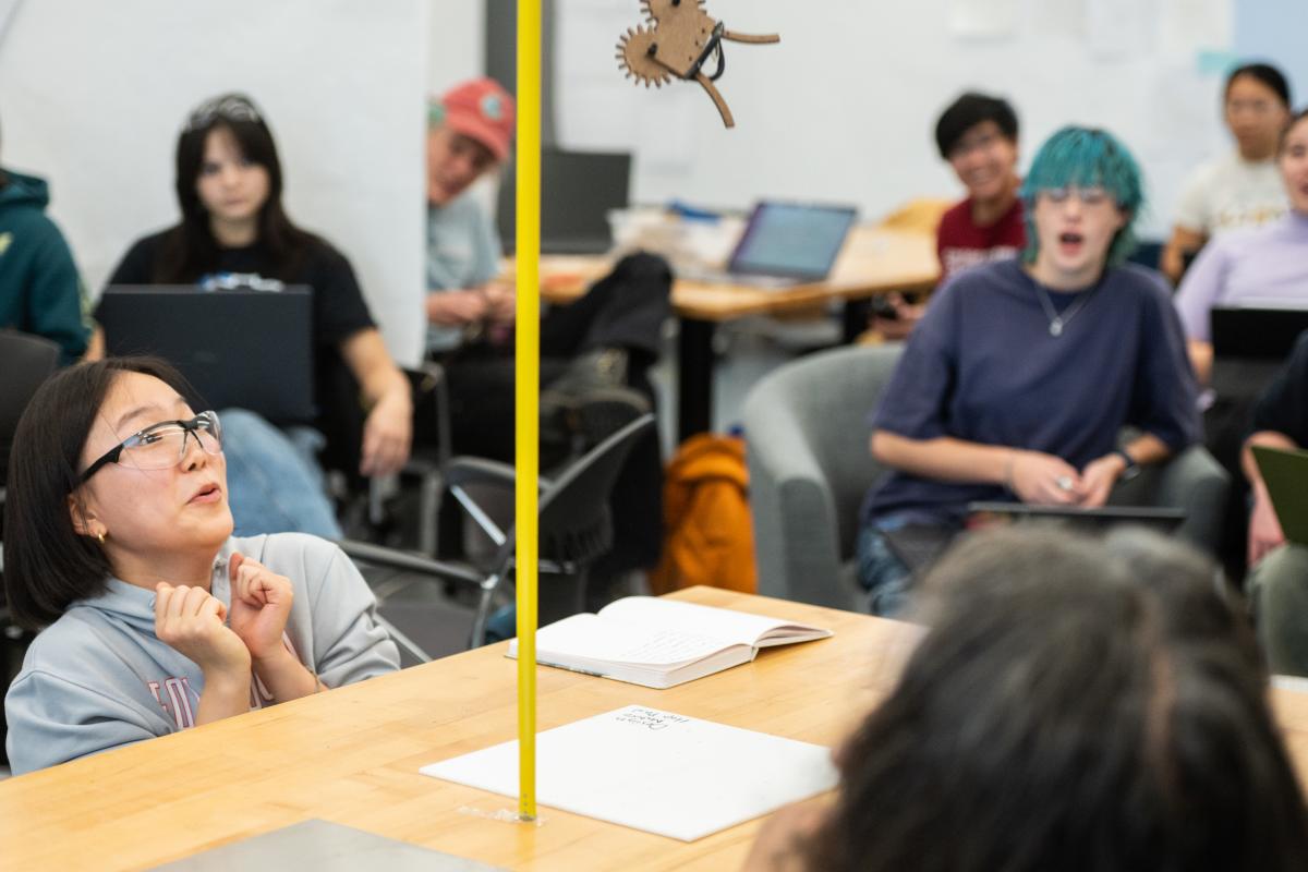 Design Nature students demo their hopper in the MAC.