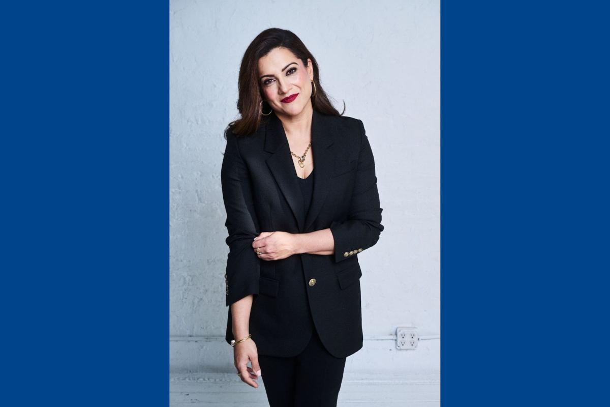 Portrait photo of Reshma Saujani standing in front of a white background