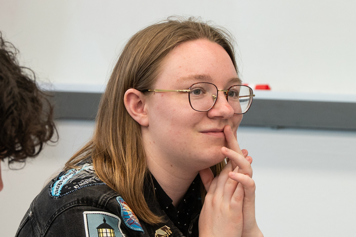 Photo of Ivy Mahncke sitting in front of a computer