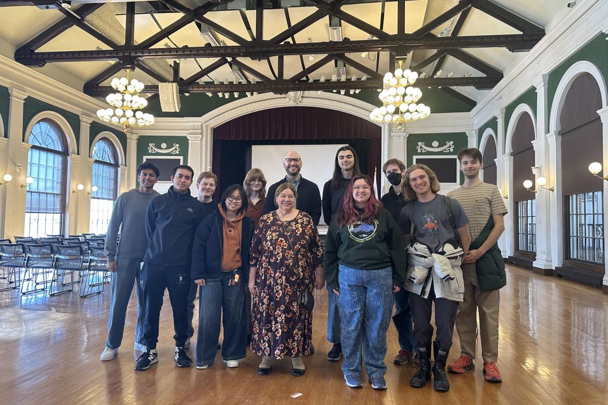 Group photo of professor Erhardt Graeff and his Local Democracy class inside Needham Town Hall