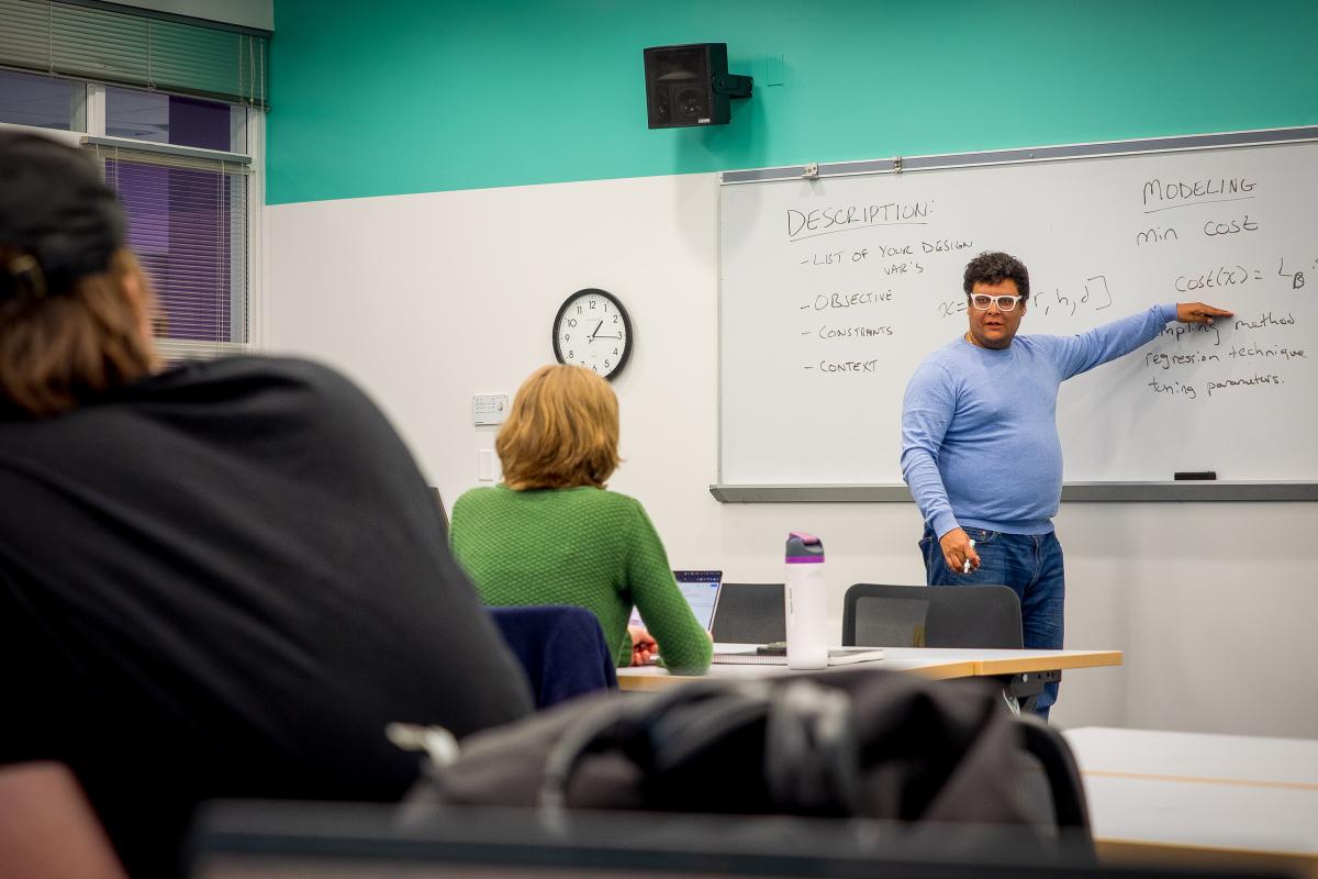 Jesse Austin-Breneman, the instructor for Olin's Biomedical Device Design course and a professor of mechanical engineering, is pictured instructing his students.