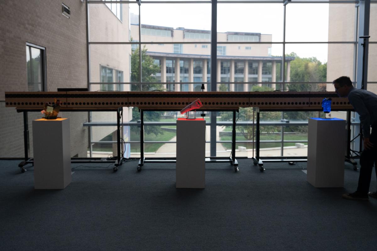 Voices of Olin Artifacts displayed on pedestals.
