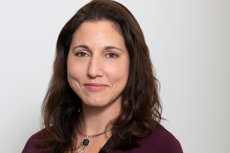 A photo of a woman smiling for the camera