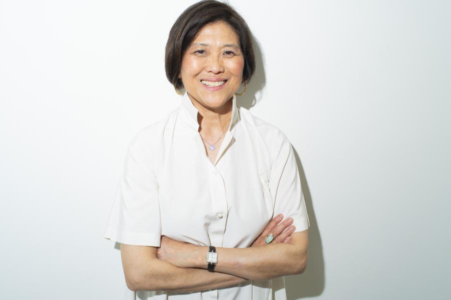 Olin College of Engineering President R. May Lee, visionary entrepreneur and education leader, stands with her hands folded while smiling. Olin College of Engineering President R. May Lee, visionary entrepreneur and education leader, stands with her hands folded while smiling.