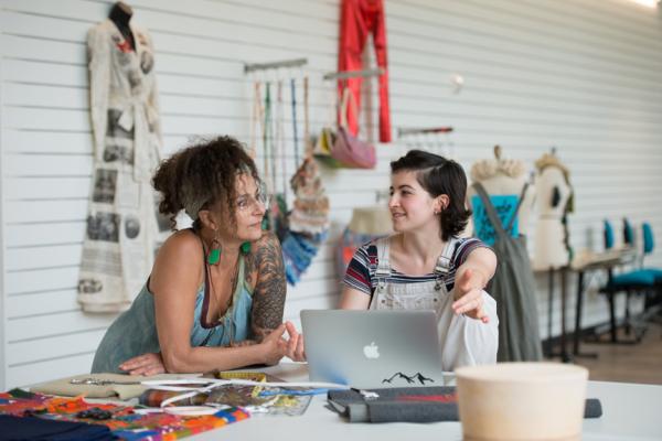 Two women talking to one another